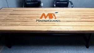 Custom-made wood table with logo inlay